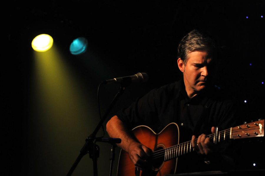 Lloyd Cole performing on stage with his guitar. Cole is a British musician who rose to fame in the 1980s.  (Courtesy of Lloyd Cole)