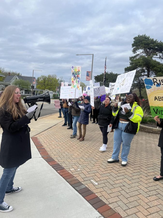  Protesters demonstrating views against Sexual Violence in front of Van Orthopedic, during Take Back the Night Monday night. ( Kaitlyn Lee-Gordon | Northern Star )