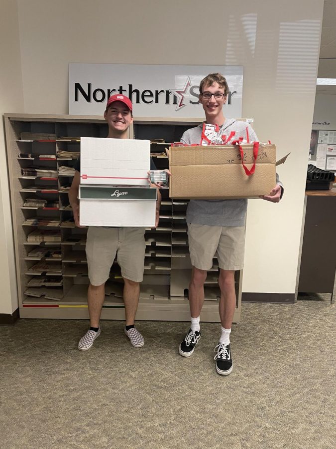 Cole Phillips (left) and Hunter Mason found the paperweight and took home approximately $300 worth of gift cards, cash and physical prizes. (Madelaine Vikse | Northern Star)