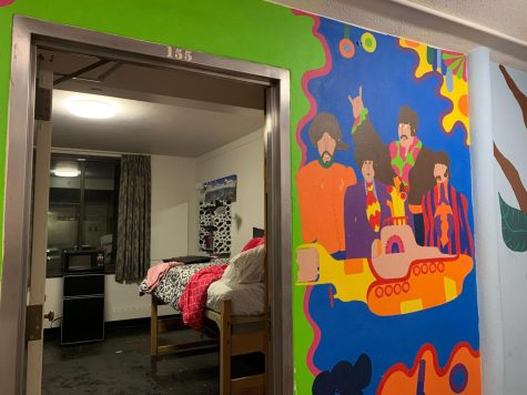 A mural of The Beatles painted on the outside of a mock-up single dorm in Neptune North. Neptune North will be offering rooms starting Fall 2023. (Rachel Cormier | Northern Star)