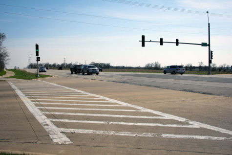 Cars drive on Peace Road Saturday near Bethany Road in 2014. The City of DeKalb plans to widen the road to four lanes and add a free-flow right turn lane by around the end of October.
