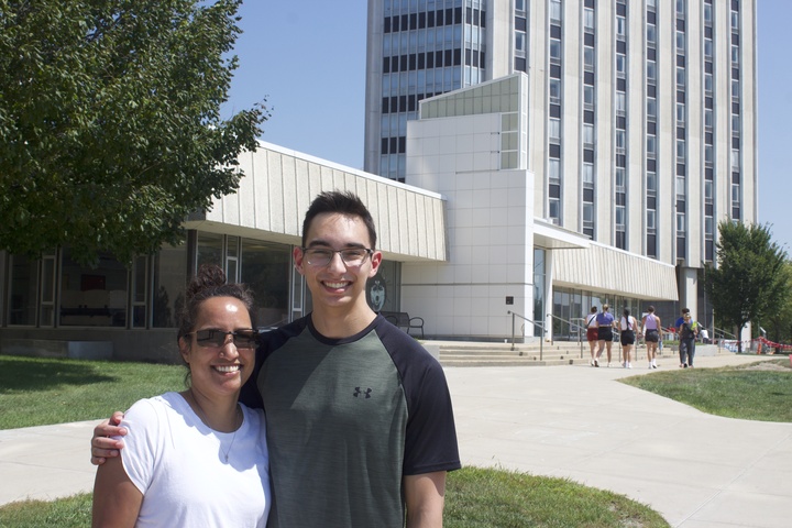 Everett Barnett, a first-year majoring in computer science, stand with his mom Catherine in front of Grant Towers on Thursday. First-year and returning students moved over the weekend in preparation for the Fall semester. (Joey Trella | Northern Star)