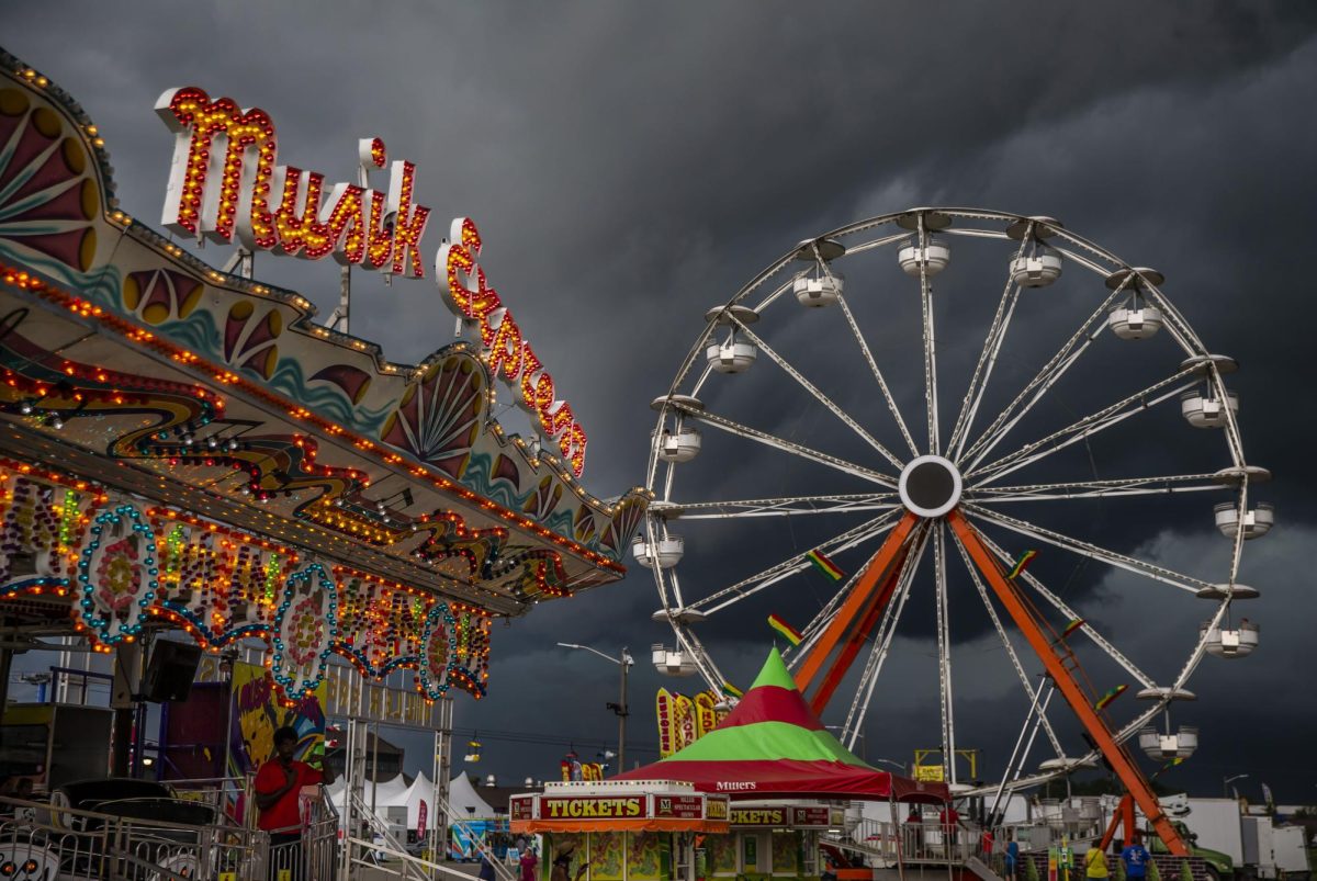 Storm clouds roll over the Miller Spectacular Shows Midway at the Illinois State Fairgrounds on Aug. 12, 2021, in Springfield. The 2023 Illinois State Fair saw over 700,000 attendees during the 11-day event. (Justin L. Fowler | Associated Press)