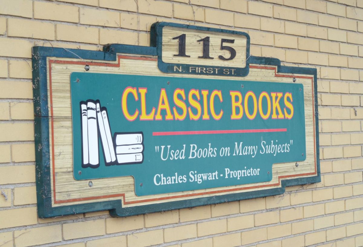 A sign for Classic Books sits on the wall of a Garage. Classic Books is a bookstore in downtown DeKalb. (Northern Star File Photo)