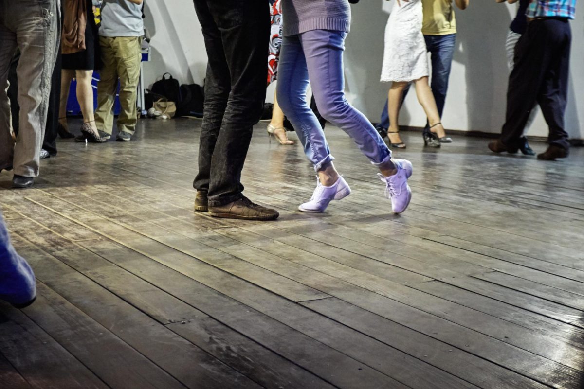 A+group+of+people+dance+on+a+hardwood+floor.+Dimensions+Dance+Academy+begins+its+Fall+Ballroom+series+Oct.+7.+%28Courtesy+of+Getty+Images%29