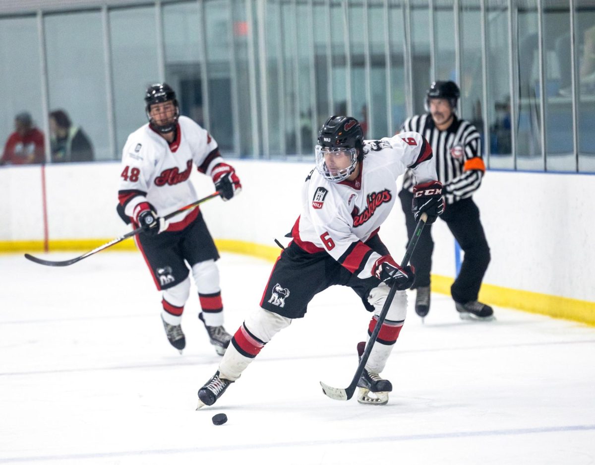 NIU+graduate+forward+Nick+Gonzalez+rushes+the+puck+up+the+ice+during+NIU+hockeys+exhibition+game+against+the+Wisconsin+Rapids+Riverkings+on+Sept.+8.+Gonzalez+scored+NIUs+third+goal+in+the+teams+4-3+loss+to+Kent+State+on+Saturday.+%28Beverly+Buchinger+%7C+NIU+hockey%29