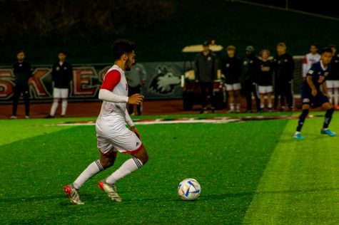 Then-senior Luis Hernandez handles the ball in mens soccers match against UIC on Sept. 12, 2022. The Huskies lost the match 2-0. (Milly Landa | Northern Star)