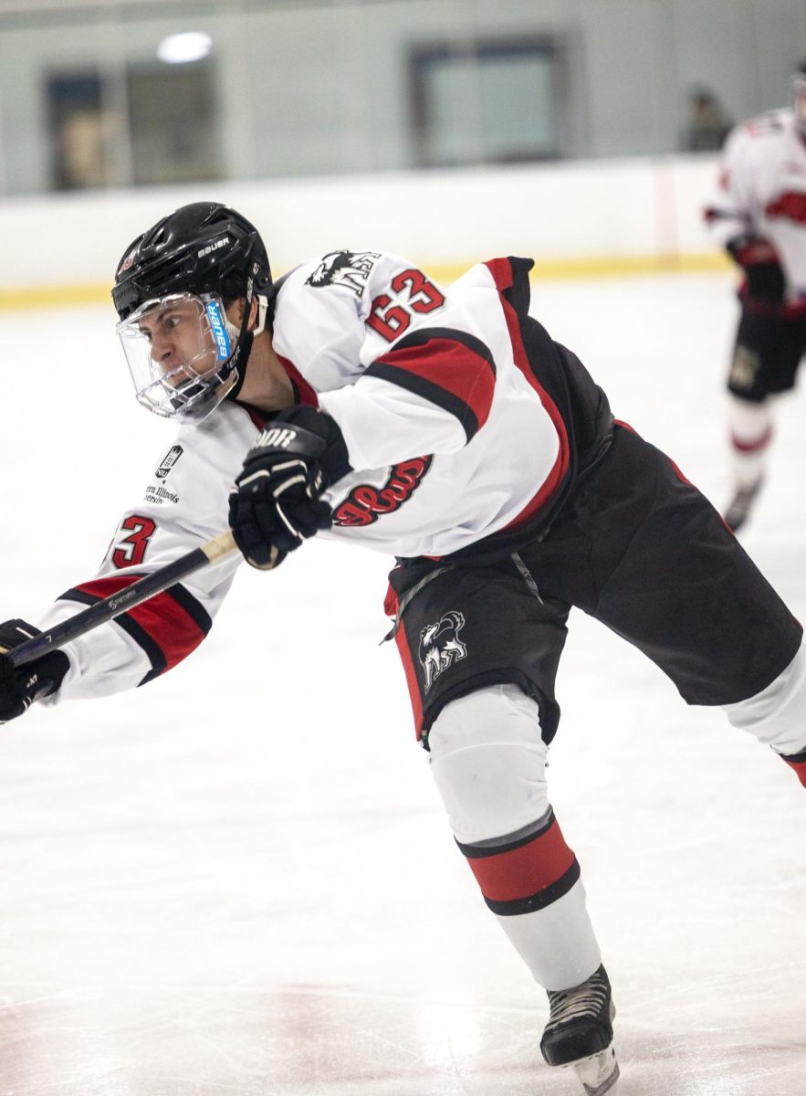 Freshman forward Micah Maldonado shoots the puck during NIU hockeys exhibition game against the Wisconsin Rapids Riverkings on Sept. 8. The Huskies dropped their home opener to Kent State Friday by a score of 8-2. (Beverly Buchinger | NIU hockey)