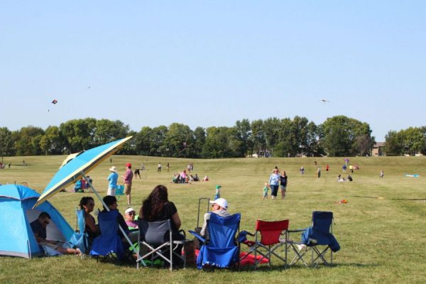 Families sit together during the 2017 DeKalb Kite Fest. This year, the festival takes place on Sept. 10. (Northern Star File Photo)