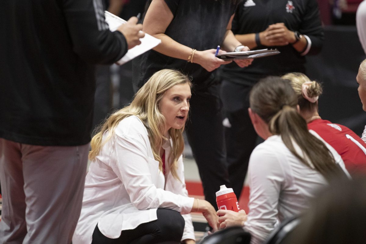 NIU volleyball head coach Sondra Parys talks with her team courtside during the Huskies season-opening match against Chicago State University on Aug. 25 at the NIU Convocation Center. Parys earned her first win as an NCAA Division I head coach Friday, a 3-2 victory over the University of North Carolina Wilmington. (Scott Walstrom | NIU Athletics)