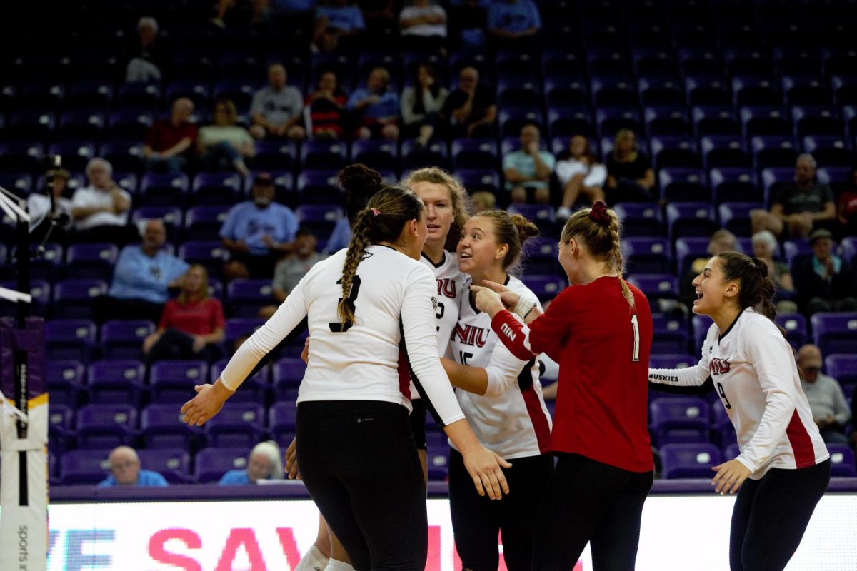 Graduate student outside hitter Katie Erdmann, junior middle blocker Charli Atiemo, senior opposite/outside hitter Emily Dykes, senior setter Ella Mihacevich, junior libero Crew Hoffmeier and junior defensive specialist/libero Jada Cerniglia celebrate after a rally in Friday’s morning match between NIU and the University of Dayton at the McLeod Center in Cedar Falls, Iowa. The Huskies fell to Dayton in three sets before sweeping the University of North Dakota in the following match for their first shutout victory of the season. (Logan Colglaizer | UNI Athletics)