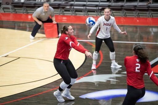 Graduate student outside hitter Katie Erdmann digs a ball during a home match against the University of Illinois on Aug. 26 at the NIU Convocation Center in DeKalb. (Scott Walstrom | NIU Athletics)
