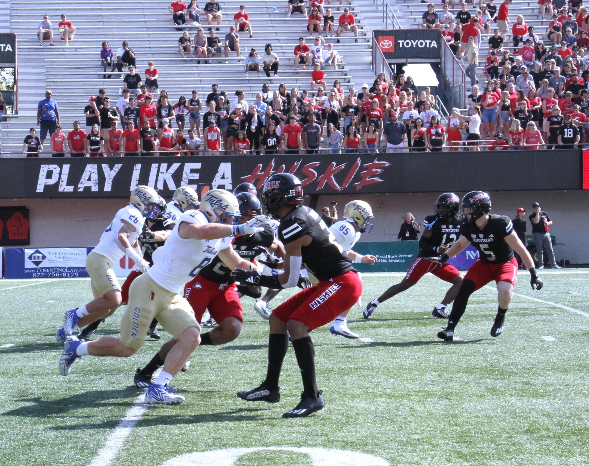University of Tulsa special teams unit pushes against NIU punt cover during Saturday games. Tulsa beat the Huskies 22-14. (Nyla Owens | Northern Star)