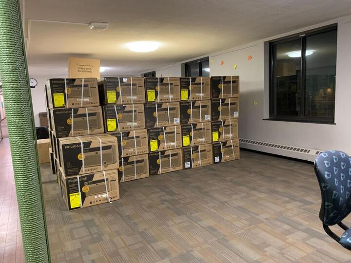 A stack of unopened air conditioning units in the Neptune North main lobby. (Rachel Cormier | Northern Star)