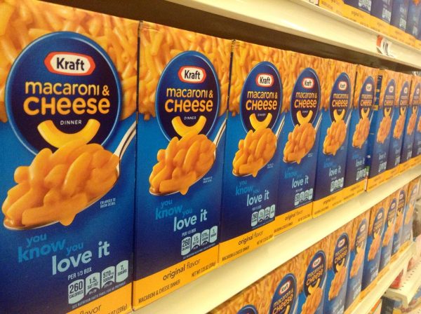 A row of Kraft Mac and Cheese sitting on a shelf down an aisle. The Kraft Heinz company, who make Kraft Mac and Cheese, are bringing a distribution center to DeKalb. (Mike Mozart via Flickr)