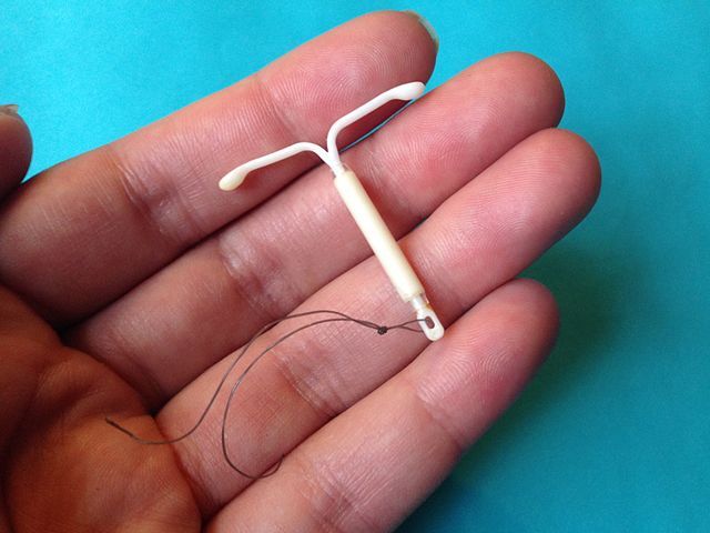 An IUD laying on a persons hand. An IUD is a form of reversible birth control that is proven to be extremely painful, but some medical personal might downplay the pain. (Courtesy of Wikimedia)