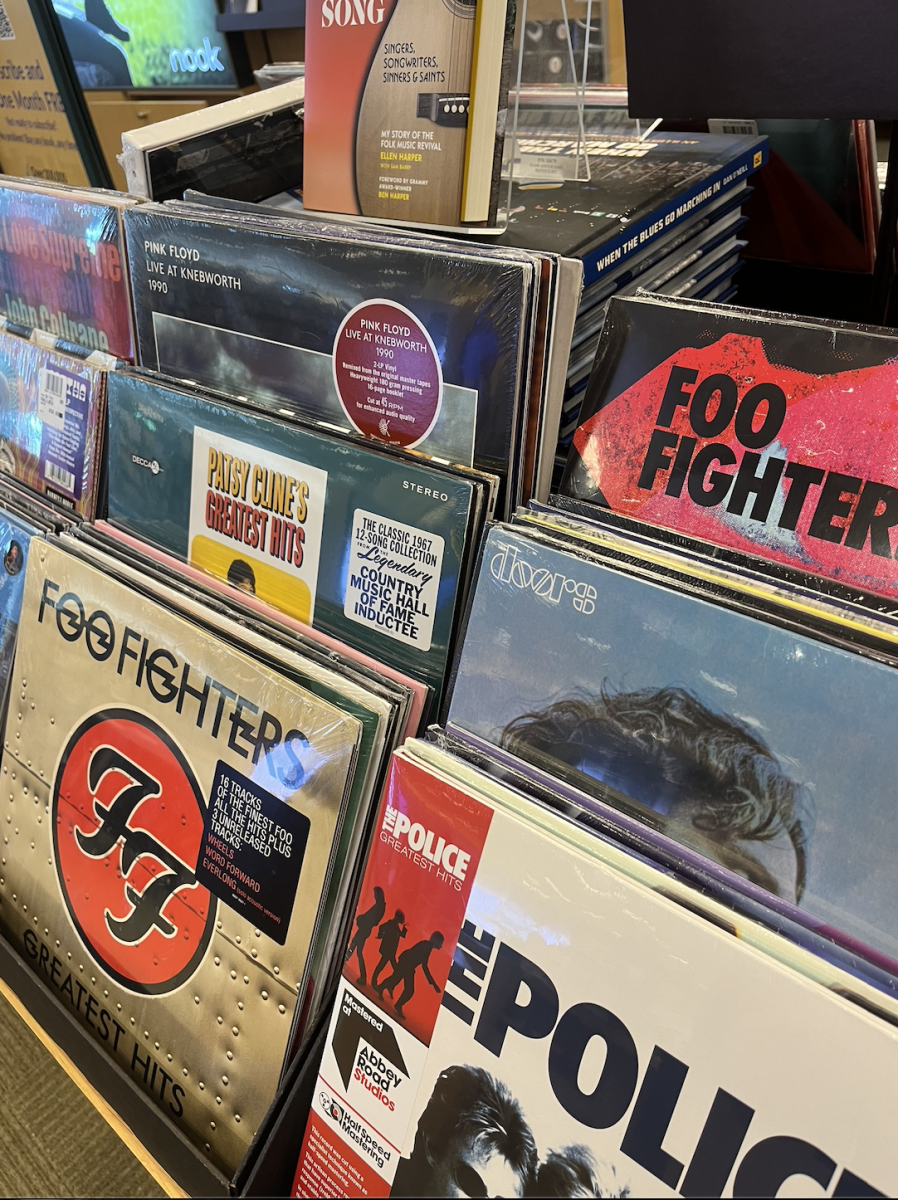 Various vinyl records stacked upright at a Barnes & Noble. Albums from Hail the Sun, PJ Harvey and Hot Mulligan released over the summer. (Sarah Rose | Northern Star)