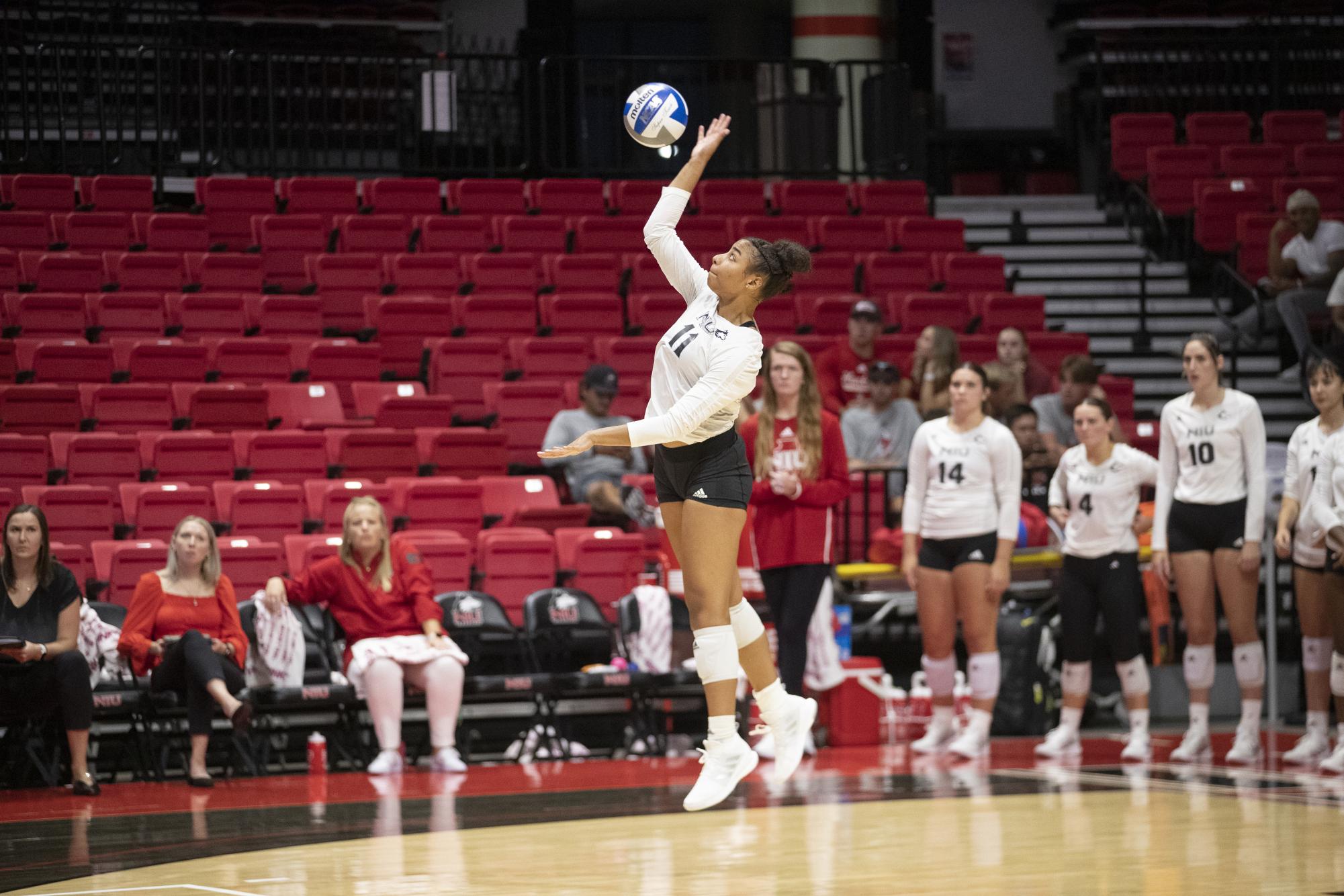 Junior middle blocker Charli Atiemo serves the ball during NIU’s season-opener against the Chicago State University Cougars on Aug. 25 at the NIU Convocation Center. The Huskies are set to play in Victor E. Court for the first time this season Friday against the Miami University RedHawks. (Courtesy NIU Athletics)