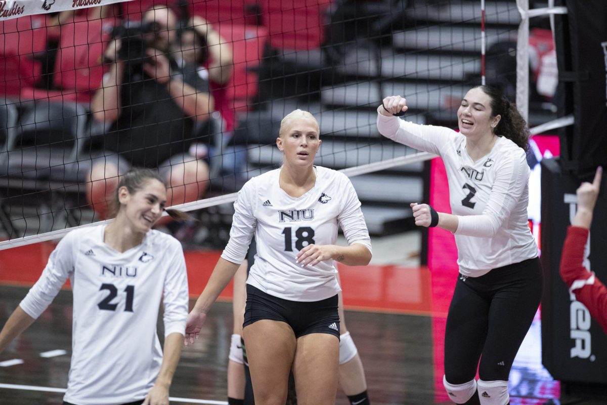 From left: Junior outside hitter Nikolette Nedic, sophomore middle blocker Savanah Brandt and graduate right side hitter Isabelle Percoco react at the end of a rally during the Huskies’ season-opener versus the Chicago State University Cougars. The Huskies are set to play two matches in Ohio to continue MAC play. (Courtesy of NIU Athletics)