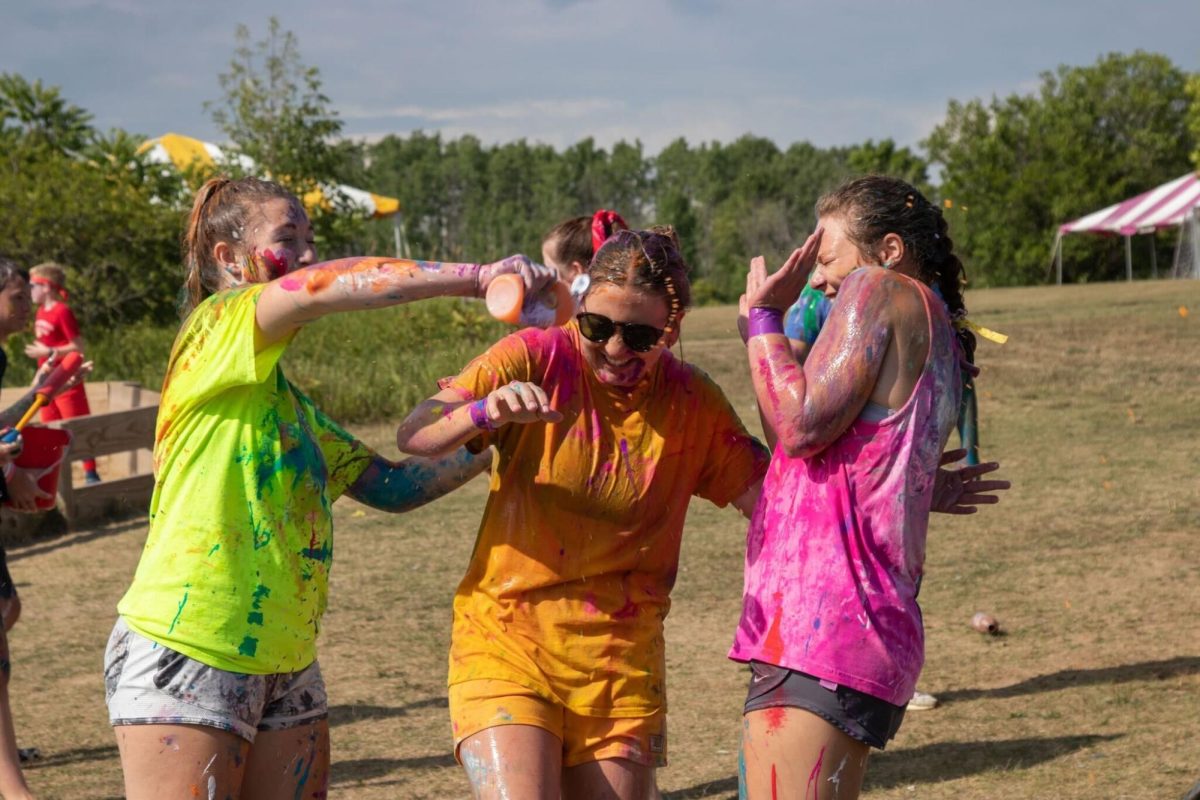 Camp Kesem campers spray each other with paint bottles during a “messy game” activity. Camp Kesem is a six day overnight summer camp for kids aged 6 to 18 whose parents have experienced cancer. (Courtesy of Leah Tobben) 