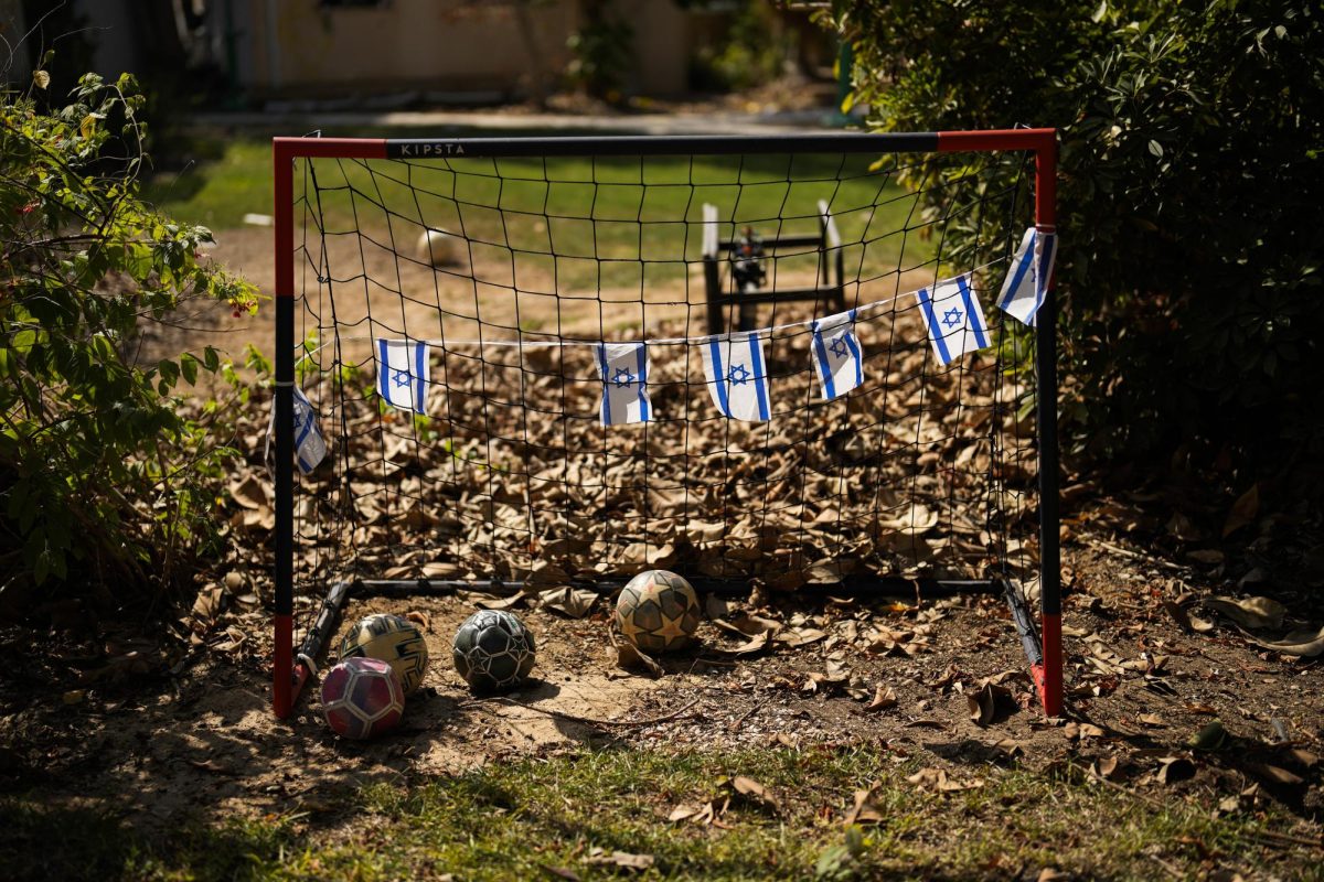 Israel flags hang on a soccer goal in a backyard of a home that came under attack during a massive Hamas invasion Oct. 19 in Kibbutz Nir Oz, Israel. American media must do a better job portraying all aspects of the Hamas-Israel conflict.  (AP Photo/Francisco Seco)