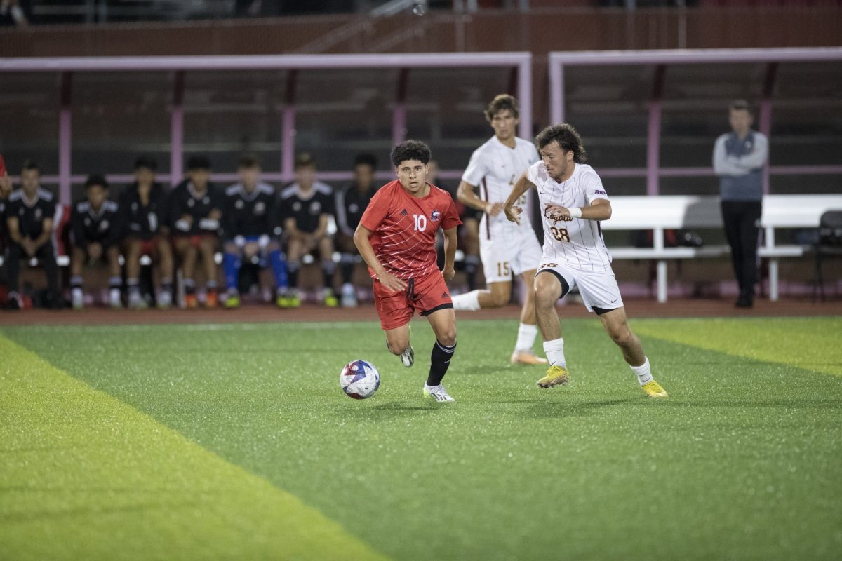 Sophomore midfielder Angel Rodriguez handles the ball against a Loyola defender on Sept. 26. The Huskies defeated Belmont by a final score of 1-0 Sunday. (Scott Walstrom | NIU Athletics)