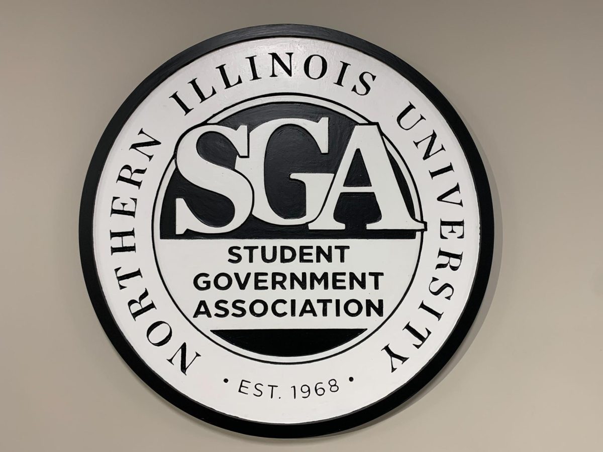 The Student Government Association sign hangs on a wall located in the Holmes Student Center ground floor in the OASIS space. SGA approved six new student student organizations on Friday. (Rachel Cormier | Northern Star)