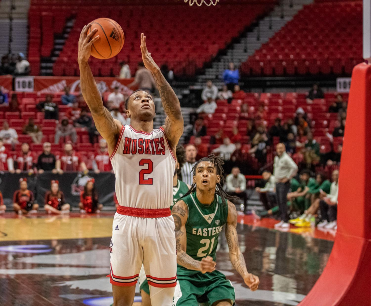 Eastern+Michigan+then-sophomore+guard+Emoni+Bates+%2821%29+approaches+NIU+then-sophomore+guard+Zarique+Nutter+%282%29+as+he+jumps+up+to+the+hoop+during+the+March+3+game+at+the+NIU+Convocation+Center.+The+Huskies+defeated+Eastern+Michigan+by+a+final+score+of+85-66.+%28Tim+Dodge+%7C+Northern+Star%29
