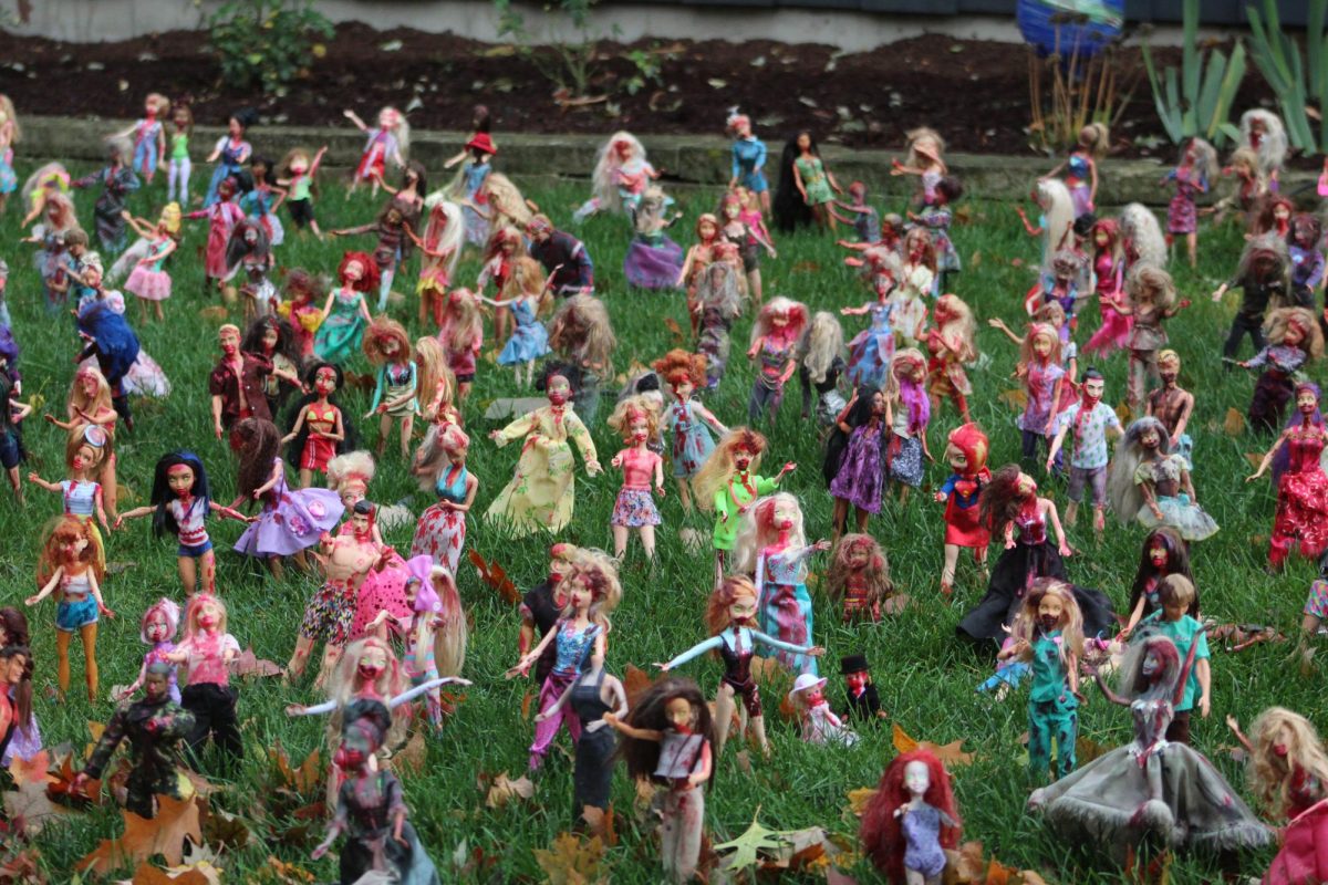 Zombie Barbie dolls stand on Amy Forkells lawn. Forkell has over 800 zombie Barbies set out for Halloween this year. (Michael Mollsen | Northern Star)
