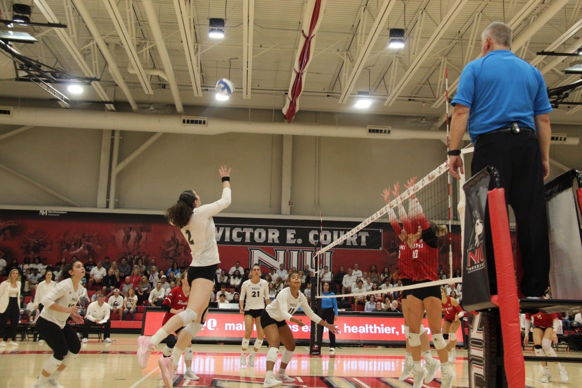 NIU graduate student right side hitter Isabelle Percoco leaps to make a play on the ball during the Huskies’ Sept. 29 against the Miami University RedHawks at Victor E. Court. NIU will return home for a pair of Homecoming match on Thursday and Friday against Eastern Michigan University. (Ryanne Sandifer | Northern Star)