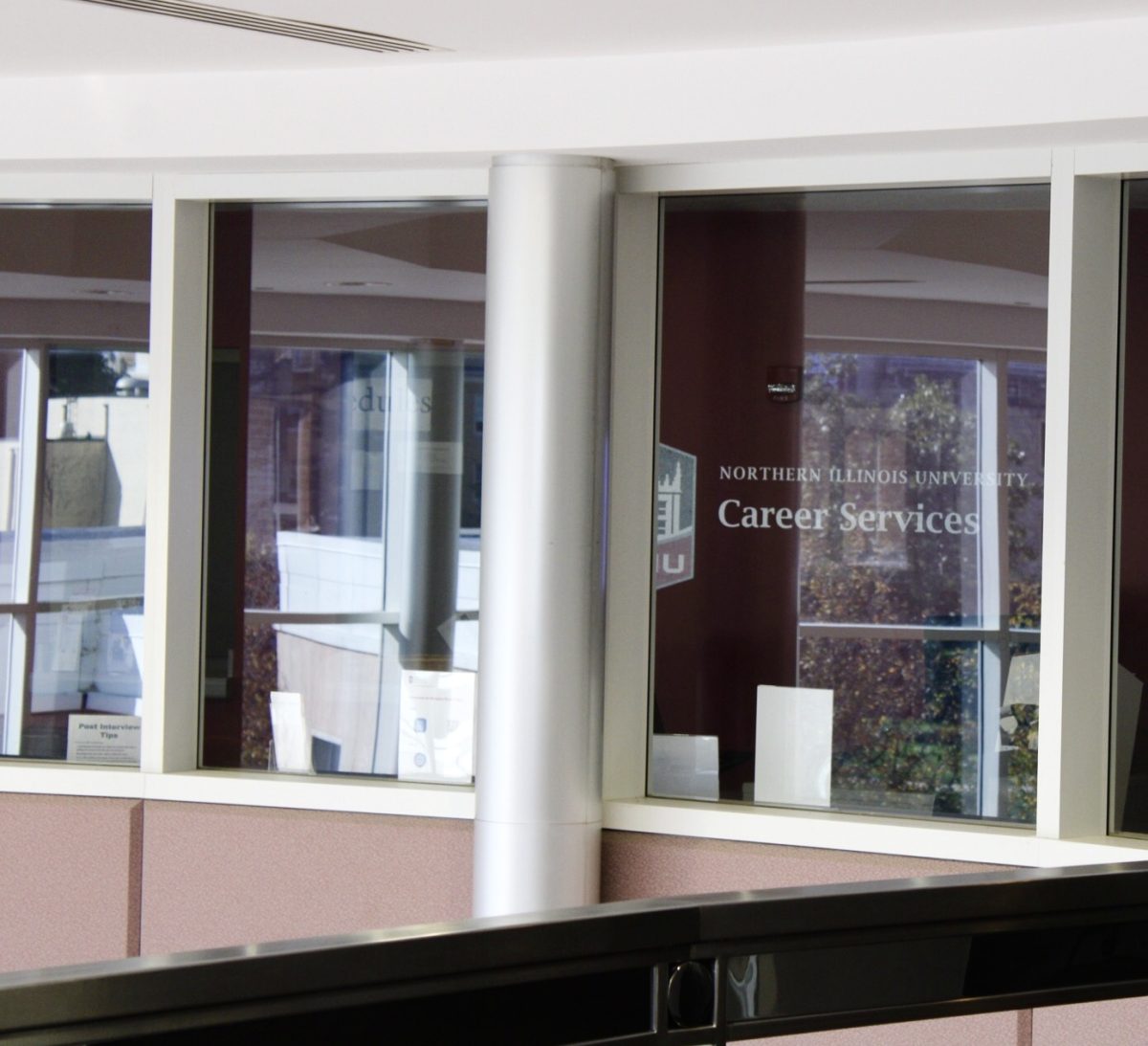 The Career Services office is visible through windows on the second level of the Peters Life Campus Building. Students should attend job fairs organized by Career Services to meet employers, present resumes and explore potential career paths. (Tim Dodge | Northern Star)