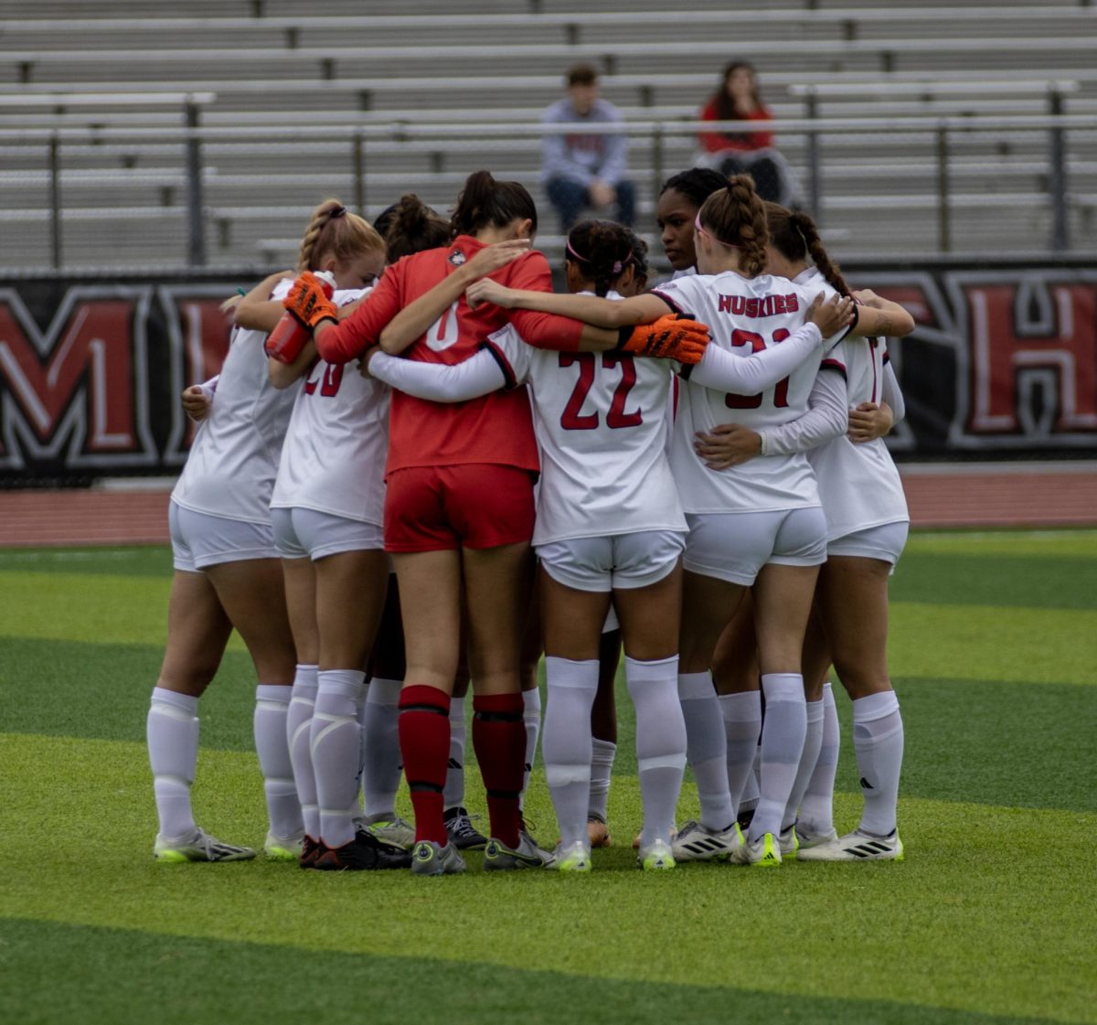 The NIU women’s soccer team huddles together before their match against Buffalo. The Huskies clinched a MAC Tournament berth with a victory over the Central Michigan University Chippewas on Sunday. (Tim Dodge | Northern Star)

