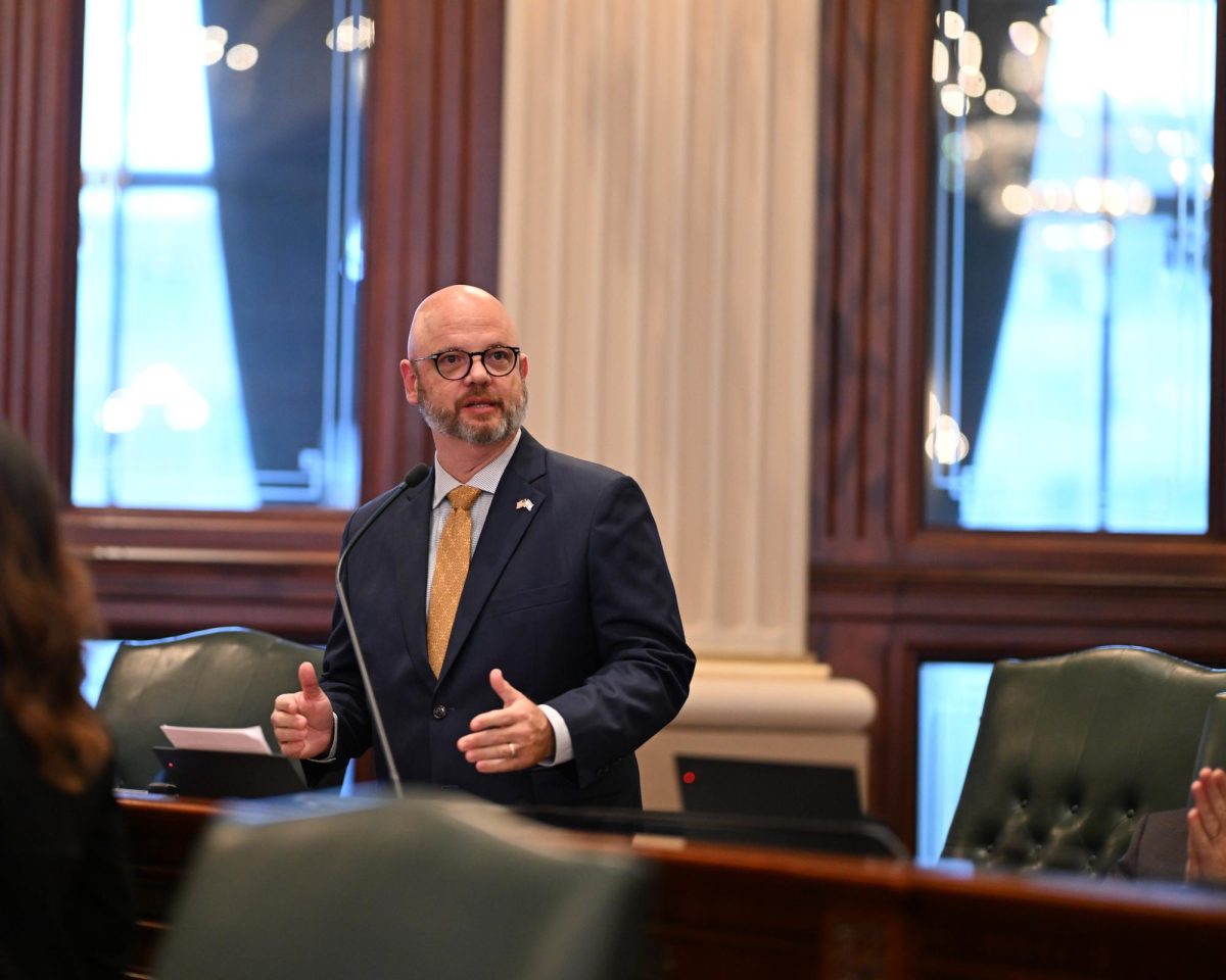 Rep. Jeff Keicher stands in the Illinois House of Representatives. Keicher brought a bill to the House last week that will bring attention to metastatic breast cancer. (Courtesy of Jeff Keicher)