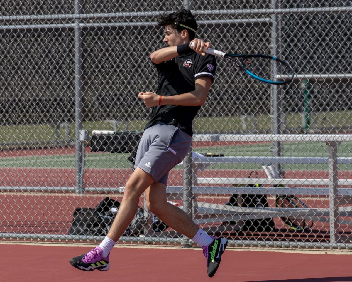 Sophomore Iker Gaztambide Arrastia hits a forehand during his singles match on April 7 at DeKalb High School. Gaztambide Arrastia was one of four Huskies that competed in the ITA All-American Championships. (Tim Dodge | Northern Star)