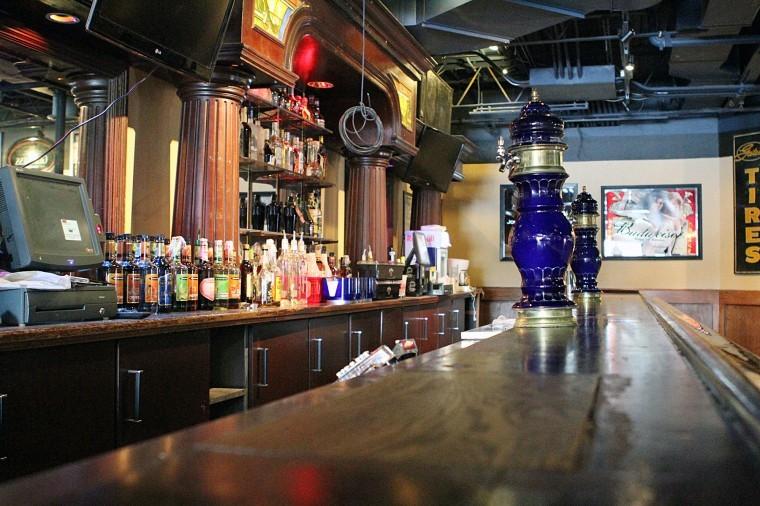 The inside of Mollys Eatery & Dinery show several drinks sitting behind the bar. Mollys is one of DeKalbs bars that attracts college students and townies. (Northern Star File Photo)