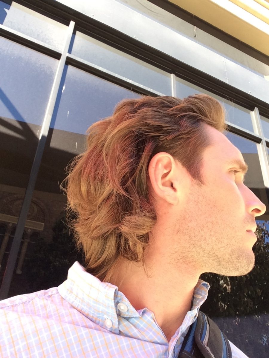 A man shows off his mullet from the side. Opinion Columnist Lexi Nebel believes a mullet can be a charming haircut on the right person. (Courtesy of Wikimedia Commons)