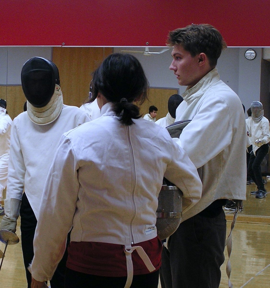 Angela Nyam-Ochir, president of Fencing Club, gives instructions to members on what skills to focus on and practice in Monday night’s meeting. (Josephine Dunmore | Northern Star)