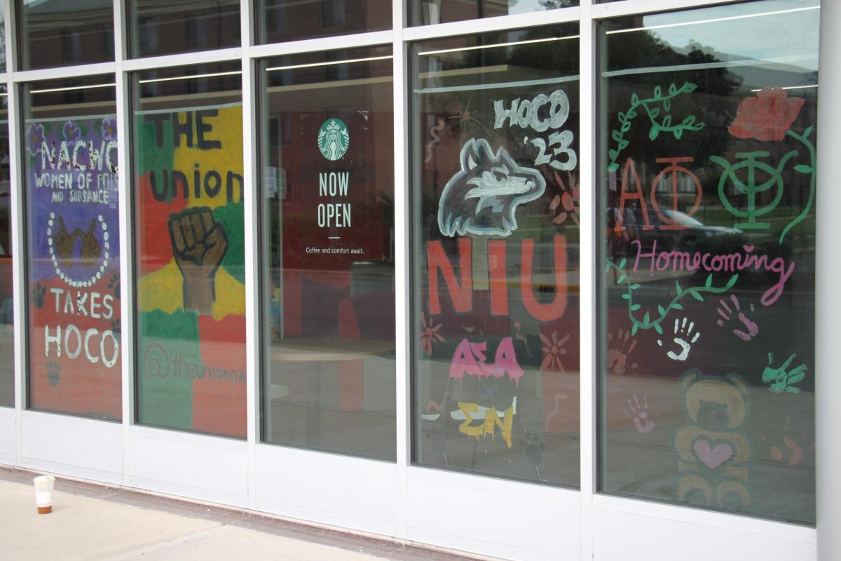 The Holmes Student Center has its windows painted on Sunday. The National Association Of Colored Women’s Club (left), The Black Student Union, Alpha Sigma Alpha and Sigma Nu,  Alpha Phi and Phi Kappa Psi.
(Ariyonna McGahee | Northern Star)