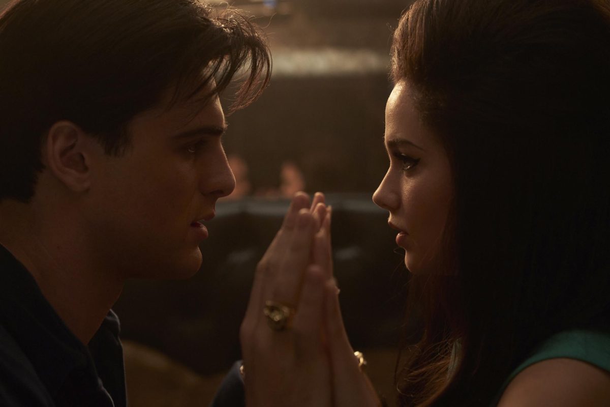 Jacob Elordi as Elvis (left) and Cailee Spaeny as Priscilla face each other and clasp hands in a scene from Priscilla. The A24 film releases in theaters on Nov. 3. (Sabrina Lantos/A24 via AP)