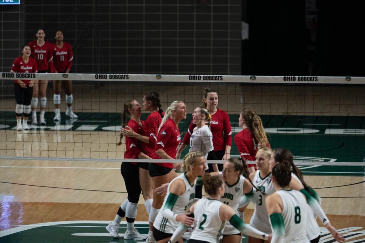 Both teams gather as Northern Illinois University scores the point at The Convocation Center in Athens, Ohio, on Oct. 5, 2023. Photo provided by The Post (Joe Hallquist) October 5, 2023.