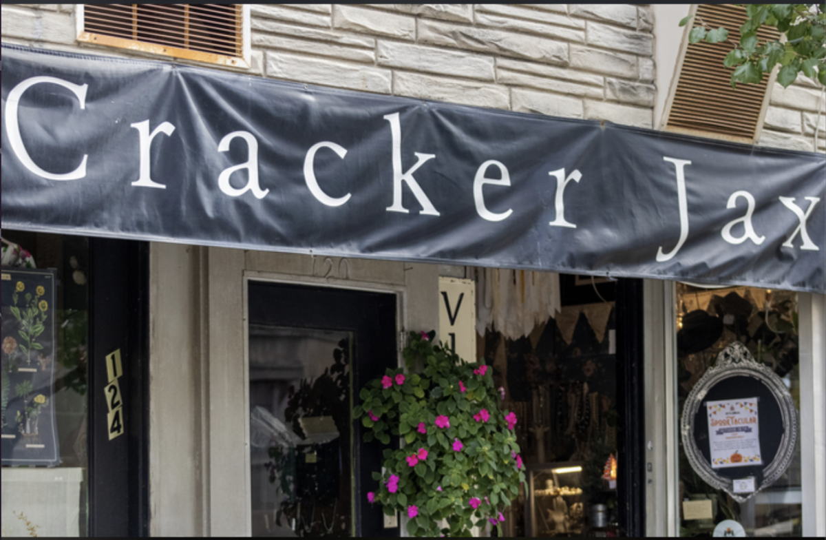 The outside front entrance of CrackerJax in downtown DeKalb located at 118 N. Third Street. Cracker Jax is DeKalb’s hidden treasure and thrift store. (Tim Dodge | Northern Star).