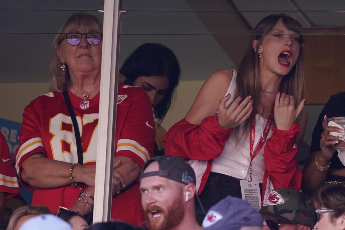 Taylor Swift (right) watches the Chicago Bears play the Kansas City Chiefs on Sept. 24 at Arrowhead Stadium. Swifts fans cheered alongside her as rumors of her dating NFL Chiefs player Travis Kelce came out. (AP Photo/Ed Zurga, File)