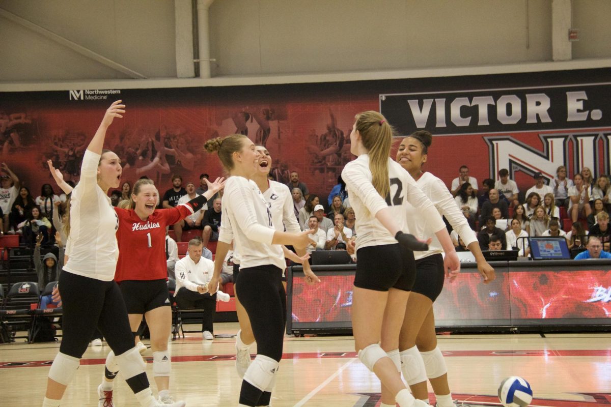 From left: Graduate outside hitter Katie Erdmann, junior libero Crew Hoffmeier, junior outside hitter Nikolette Nedic, junior middle blocker Charli Atiemo, senior opposite/outside hitter Emily Dykes and senior setter Ella Mihacevich celebrate after a rally during a MAC volleyball match between the NIU Huskies and the Miami University RedHawks on Sept. 29 at Victor E. Court. NIU is looking to build on its newfound confidence after recent wins. (Ryanne Sandifer | Northern Star) 