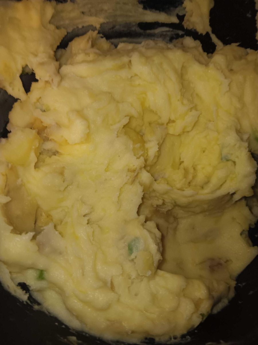 Cheesy mashed potatoes rest in a pot. Lifestyle Writer Caleb Johnson shares two homemade recipes that can be made during the holiday break. (Caleb Johnson | Northern Star) 