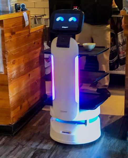 A sushi serving robot, Mushroom, is serving guests at Fushi Yami. The robot was introduced to the sushi restaurant in mid October. (Tim Dodge | Northern Star)