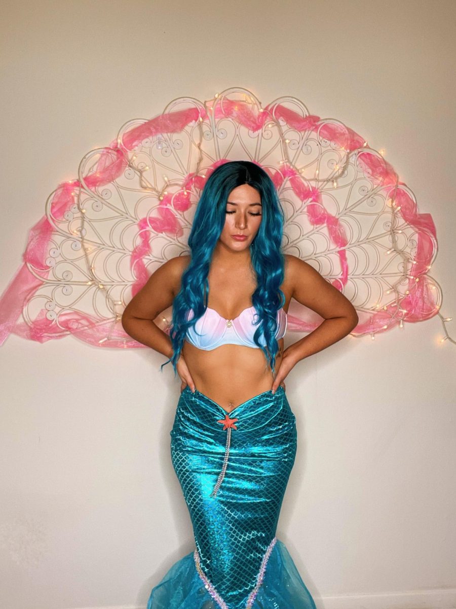 Cecilia Lucente stands against a wall while dressed as mermaid Barbie. (Courtesy of Cecilia Lucente)
