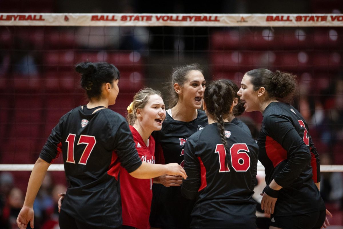 Members+of+the+NIU+volleyball+team+huddle+during+Saturday%E2%80%99s+road+match+at+Ball+State+University+in+Muncie%2C+Indiana.+The+Huskies+fell+in+five+sets+to+close+out+their+road+schedule.+%28Bobby+Ellis+%7C+Ball+State+Athletics%29