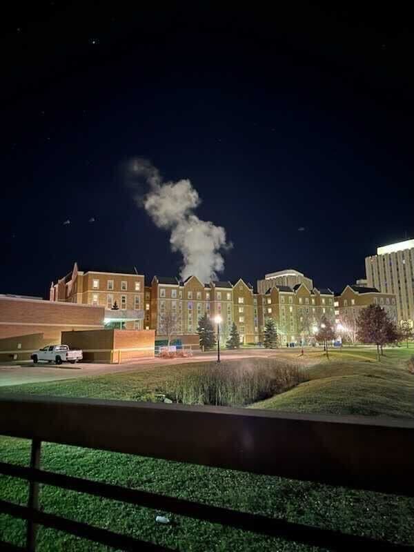 Steam rises out of the top of Patterson Hall West on Nov. 13. A steam relief valve caused an emergency evacuation of Patterson Hall residents around 2 a.m. on Nov. 14. (Courtesy of Lydia Dunker)