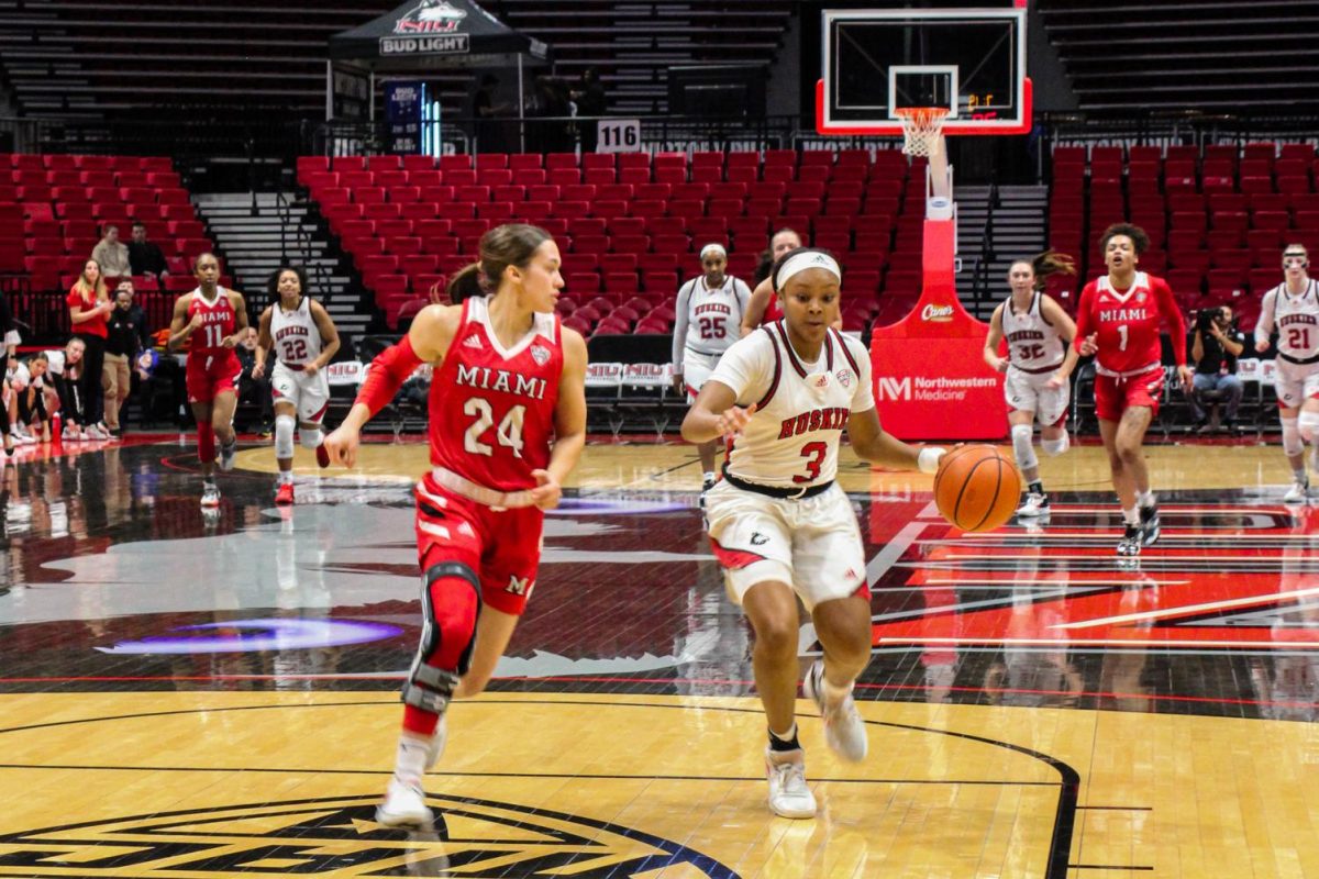 Junior guard Jayden Marable (3) drives to the basket as Miami University senior guard Peyton Scott (24) defends during Jan. 23s Mid-American Conference matchup between the Huskies and RedHawks at the NIU Convocation Center. NIU womens basketball lost its first game of the 2023-2024 season to Arkansas State University 75-62. (Nyla Owens | Northern Star)