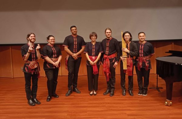 The Thai Music Ensemble stands in matching clothes. The Ensemble recently played at Recital Hall as part of the World Music Concert Series. (Caleb Johnson | Northern Star)
